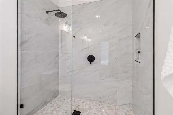 a view of a patio with table and chairs with wooden floor and fence