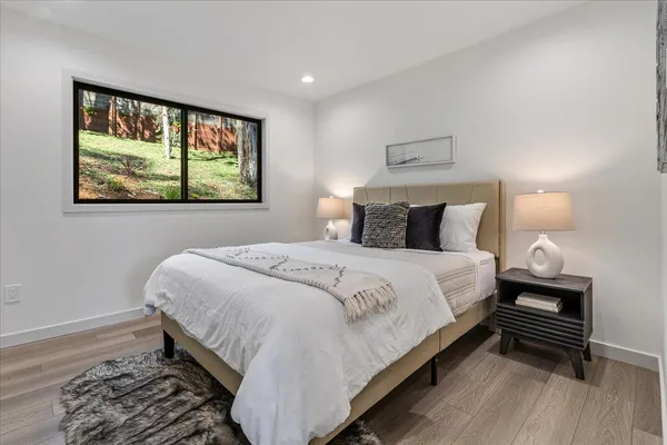 a view of a house with backyard and sitting area