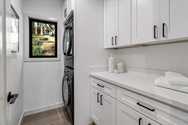 a view of a house with pool and wooden fence
