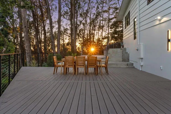a view of a house with a tree in the background
