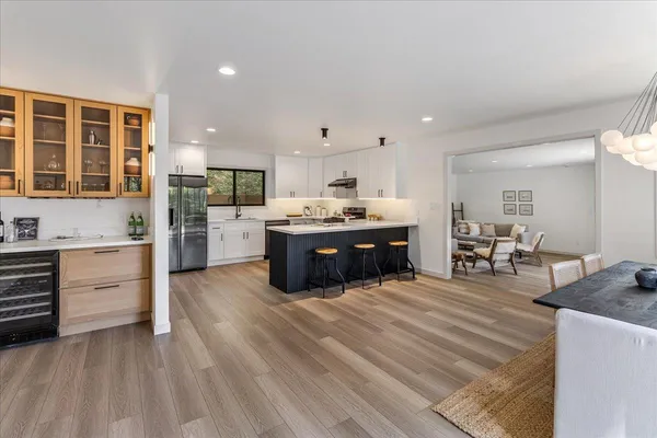 a kitchen with stainless steel appliances granite countertop a stove and cabinets