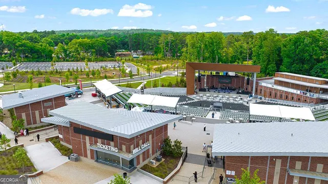 an aerial view of a house with swimming pool and outdoor space