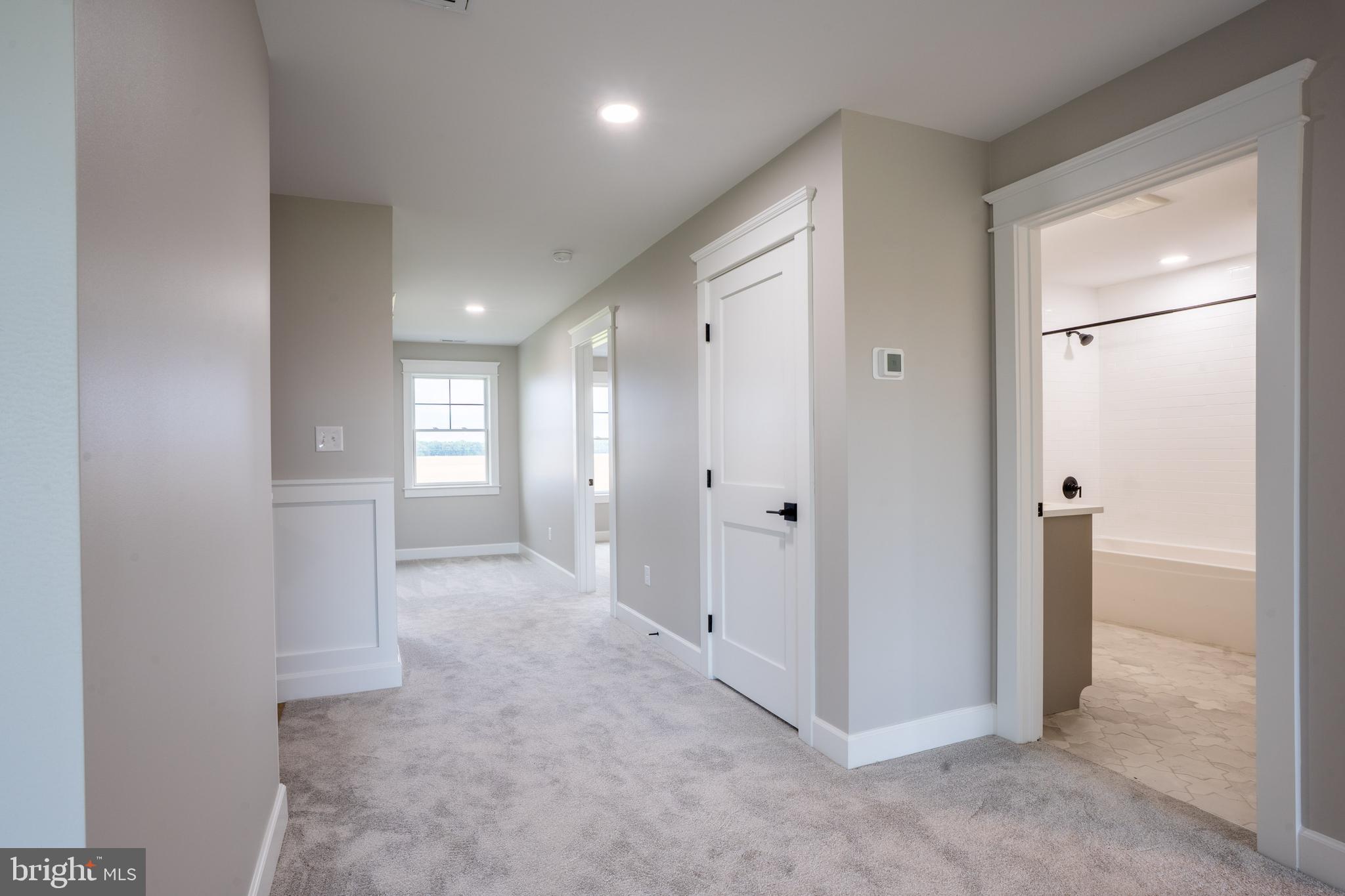22430 Hummingbird Road Ellendale, DE 19941 - Photo 24 of 39 a view of entryway with white walls and windows