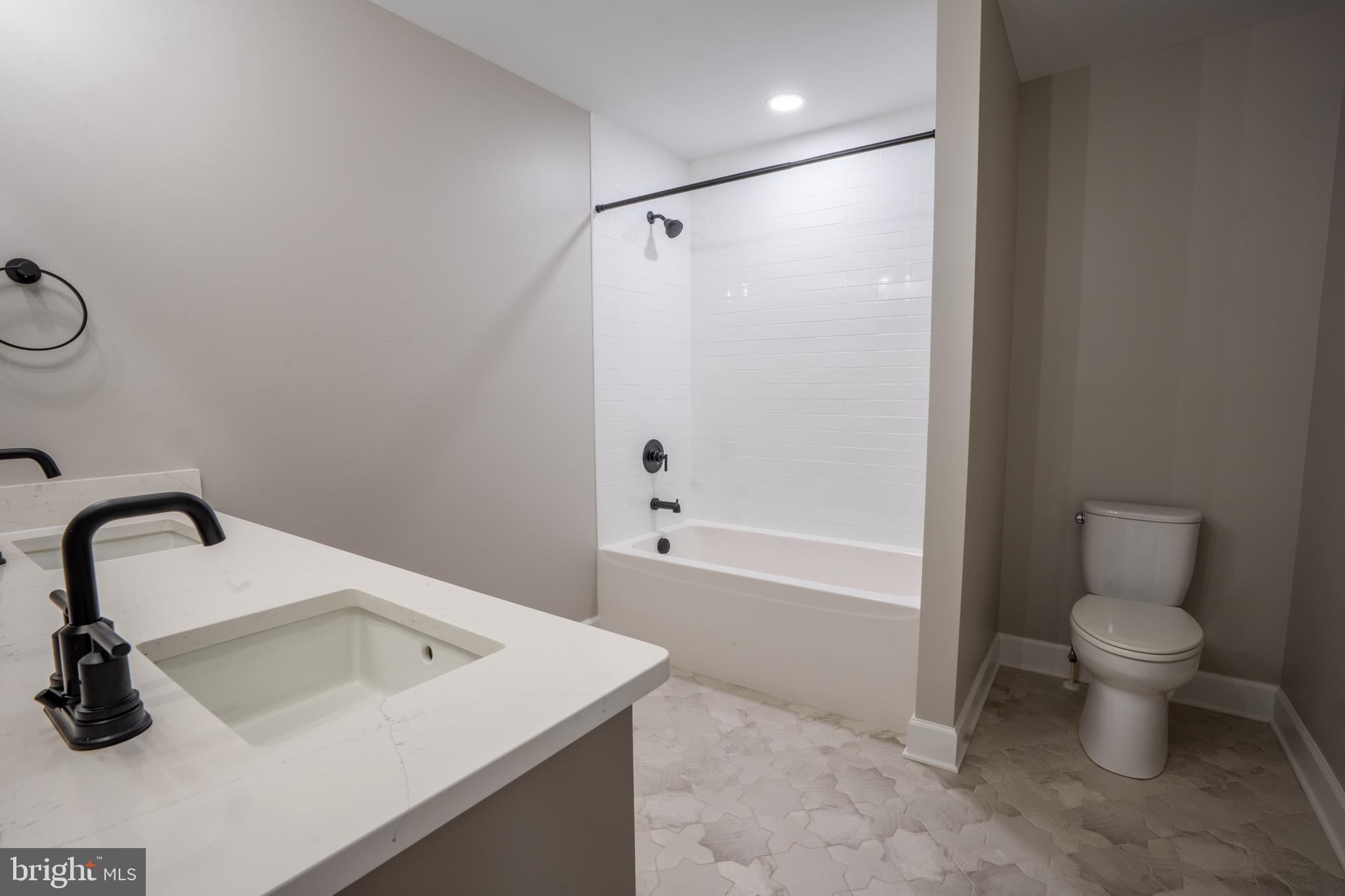 22430 Hummingbird Road Ellendale, DE 19941 - Photo 25 of 39 a bathroom with a sink toilet and shower