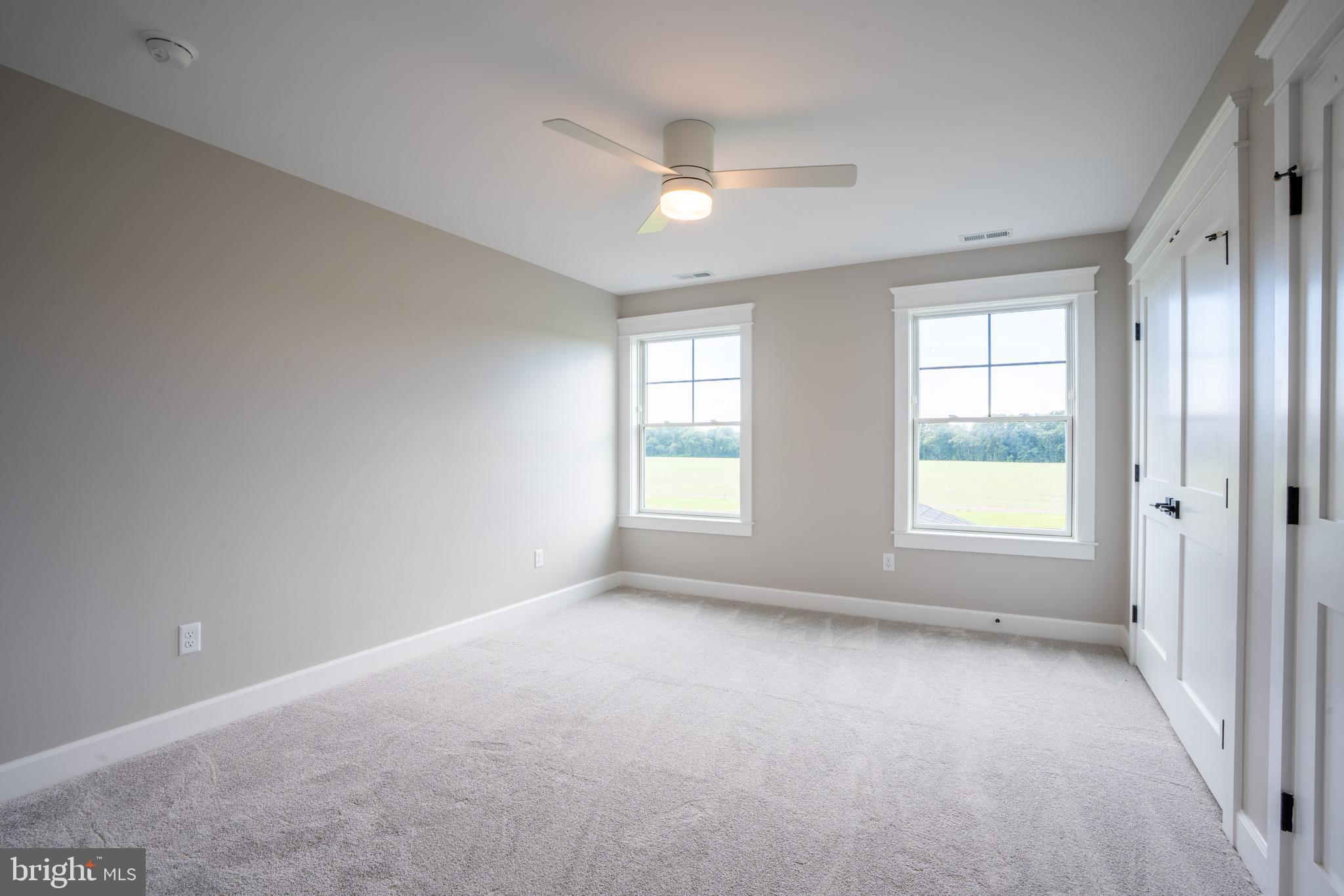 22430 Hummingbird Road Ellendale, DE 19941 - Photo 27 of 39 a view of room with window and ceiling fan