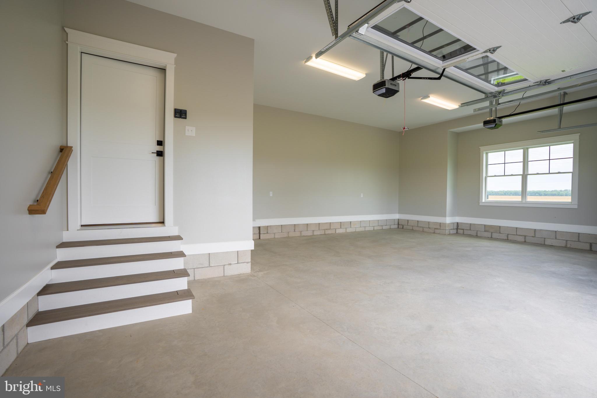 22430 Hummingbird Road Ellendale, DE 19941 - Photo 32 of 39 wooden floor in an empty room with a window