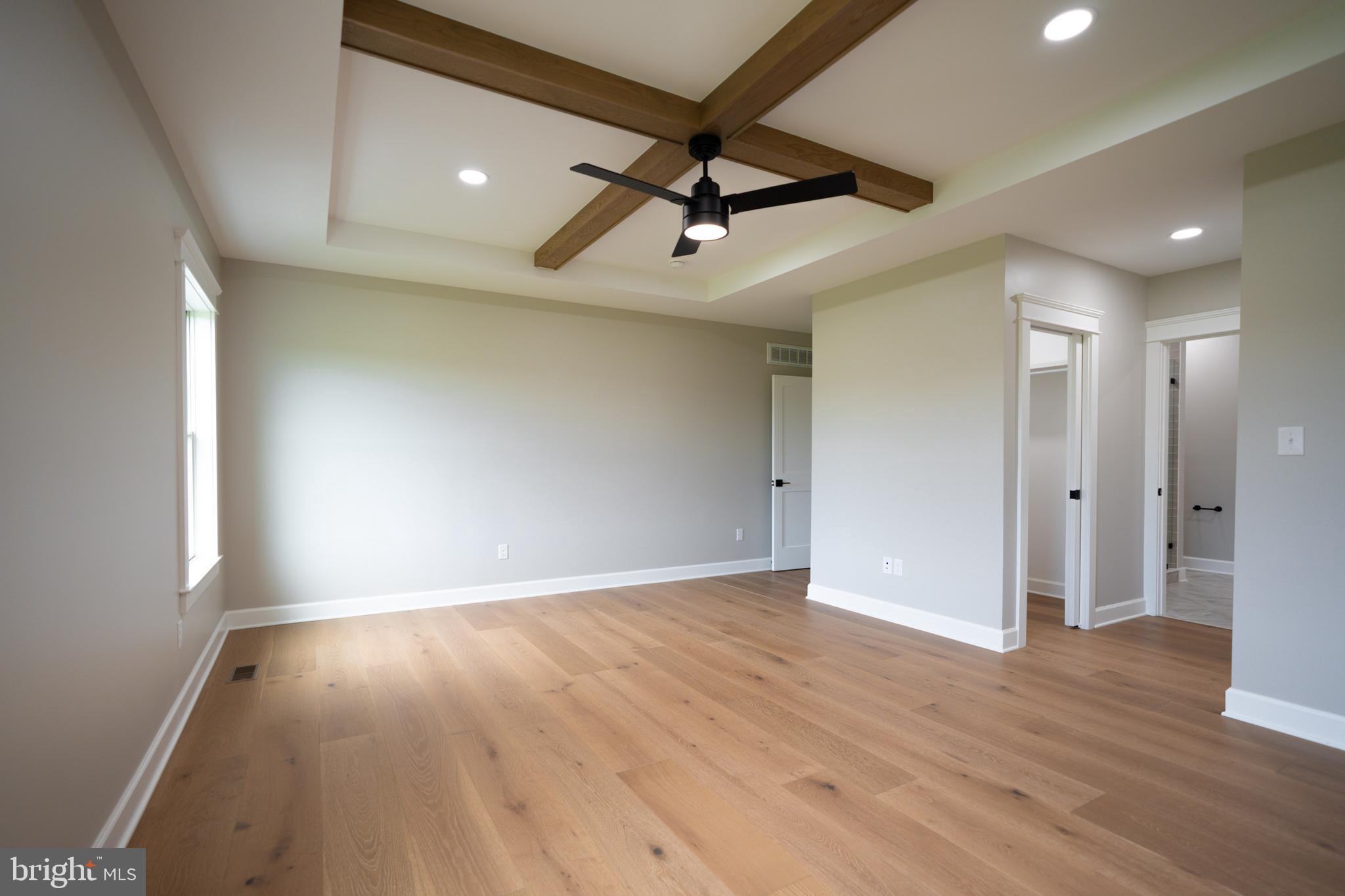 22430 Hummingbird Road Ellendale, DE 19941 - Photo 8 of 39 wooden floor in an empty room with a window