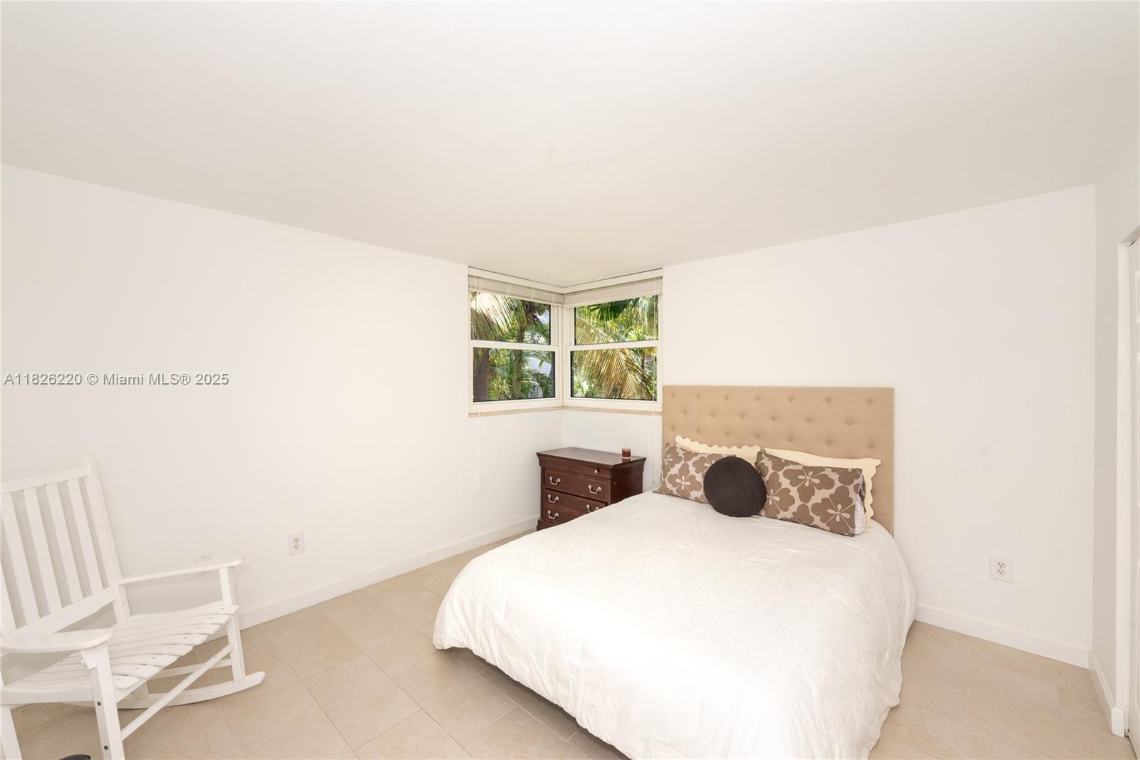 101 Ocean Ln Drive, Unit 2017 Key Biscayne, FL 33149 - Photo 11 of 25 a bedroom with a bed and window