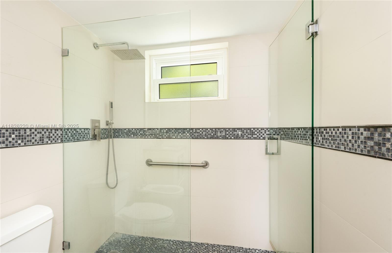 101 Ocean Ln Drive, Unit 2017 Key Biscayne, FL 33149 - Photo 13 of 25 a bathroom with a granite countertop bathtub and a shower
