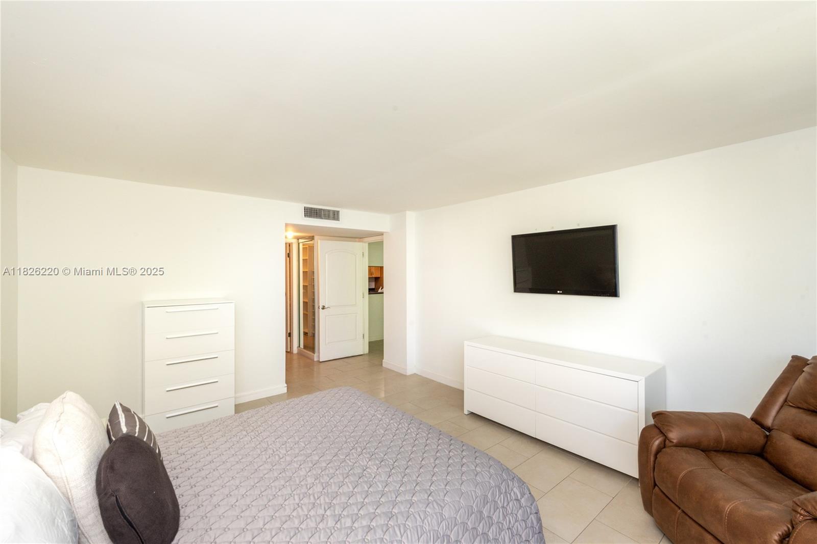 101 Ocean Ln Drive, Unit 2017 Key Biscayne, FL 33149 - Photo 23 of 25 a living room with furniture and a flat screen tv