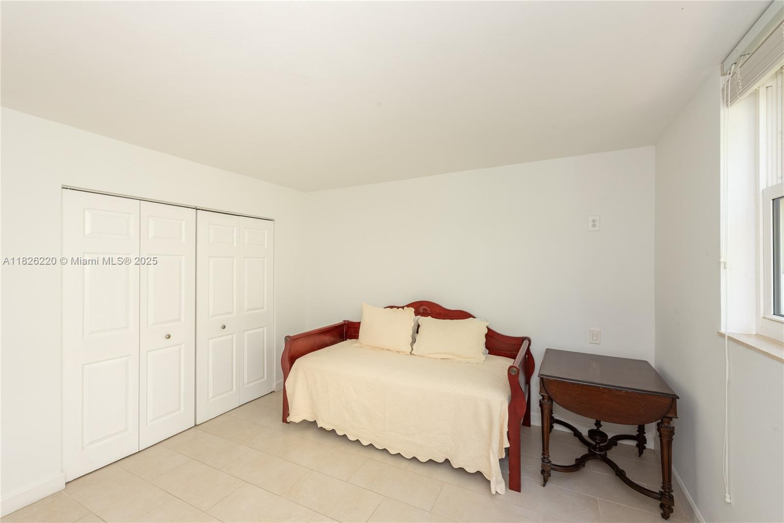 101 Ocean Ln Drive, Unit 2017 Key Biscayne, FL 33149 - Photo 25 of 25 a bedroom with a bed and a chair