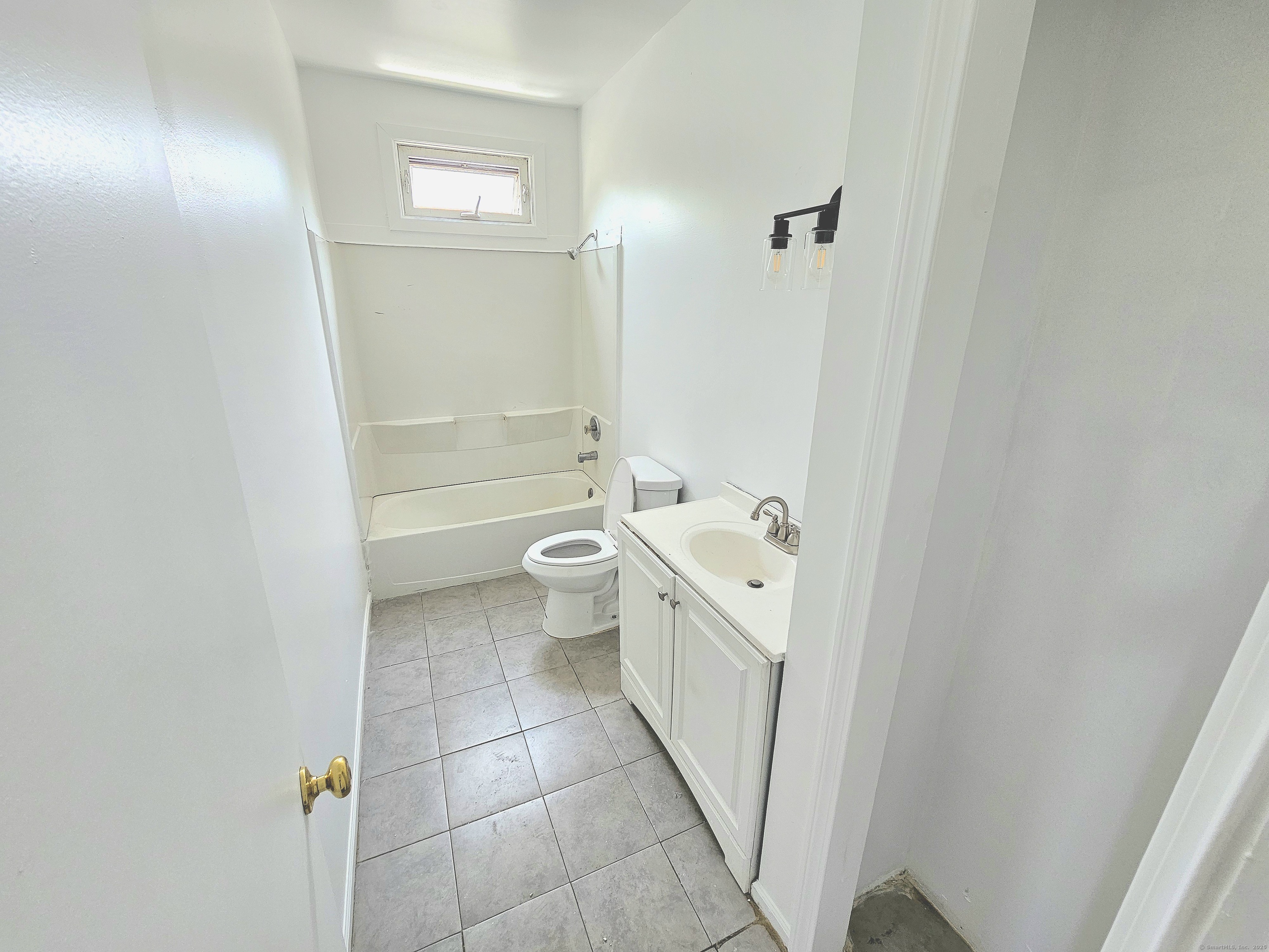 483 Ferry Street, Unit 2 New Haven, CT 06513 - Photo 11 of 11 a bathroom with a granite countertop sink a toilet and shower