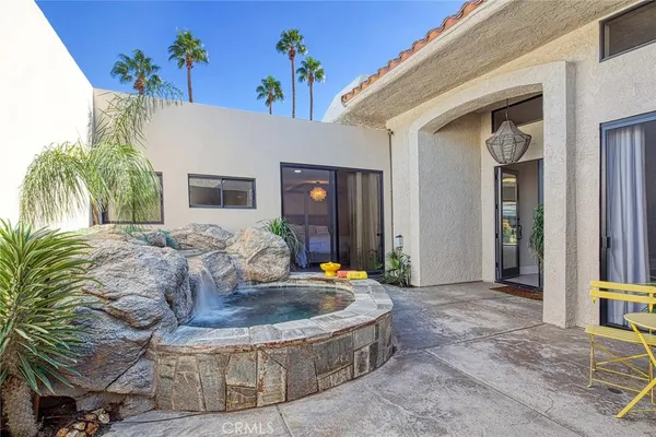 a house view with a outdoor seating space