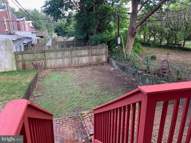 a view of backyard with green space