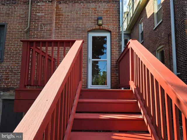 a view of balcony with wooden floor and stairs