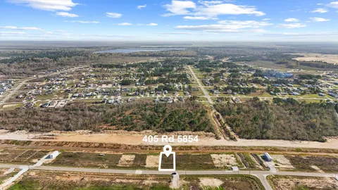 an aerial view of residential building and parking space