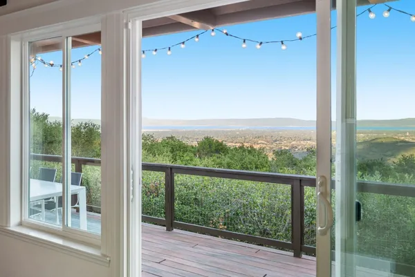 a view of a balcony with wooden floor