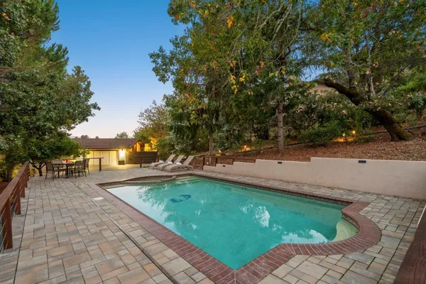 a view of a swimming pool with a patio