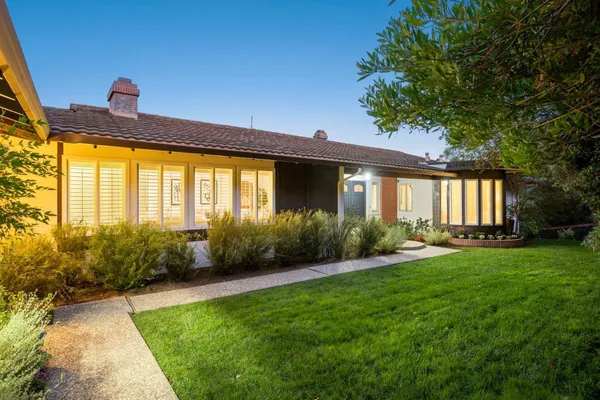 a house view with a garden space