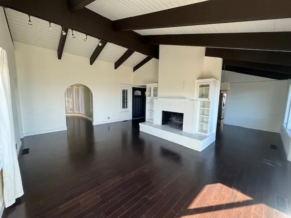a view of entryway with wooden floor