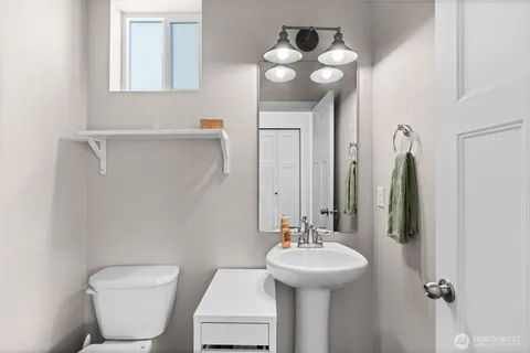 a bathroom with a granite countertop sink
