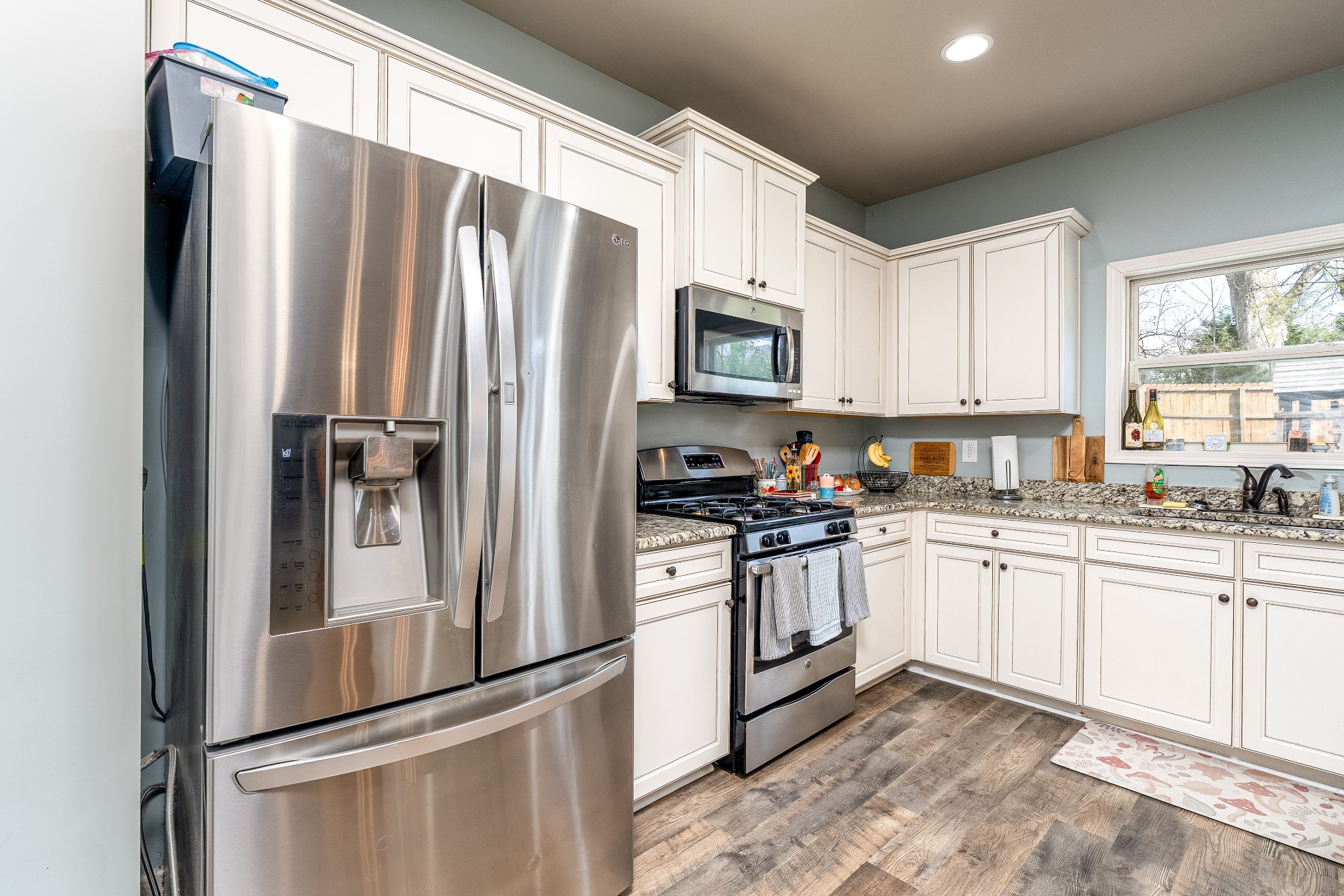 2034 Austin Drive Spring Hill, TN 37174 - Photo 11 of 41 a kitchen with granite countertop a refrigerator stove and sink
