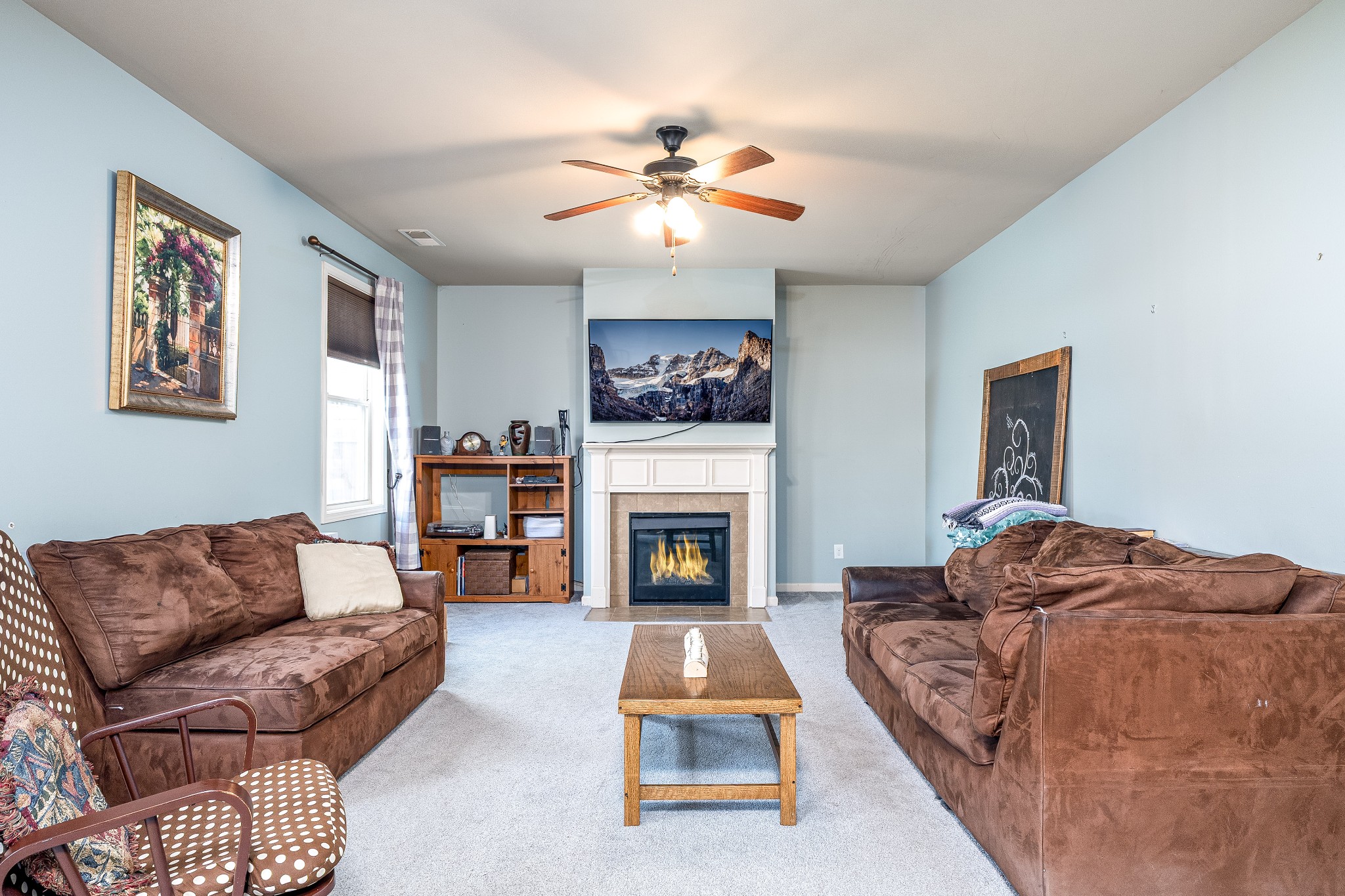 2034 Austin Drive Spring Hill, TN 37174 - Photo 14 of 41 a living room with furniture and a fireplace