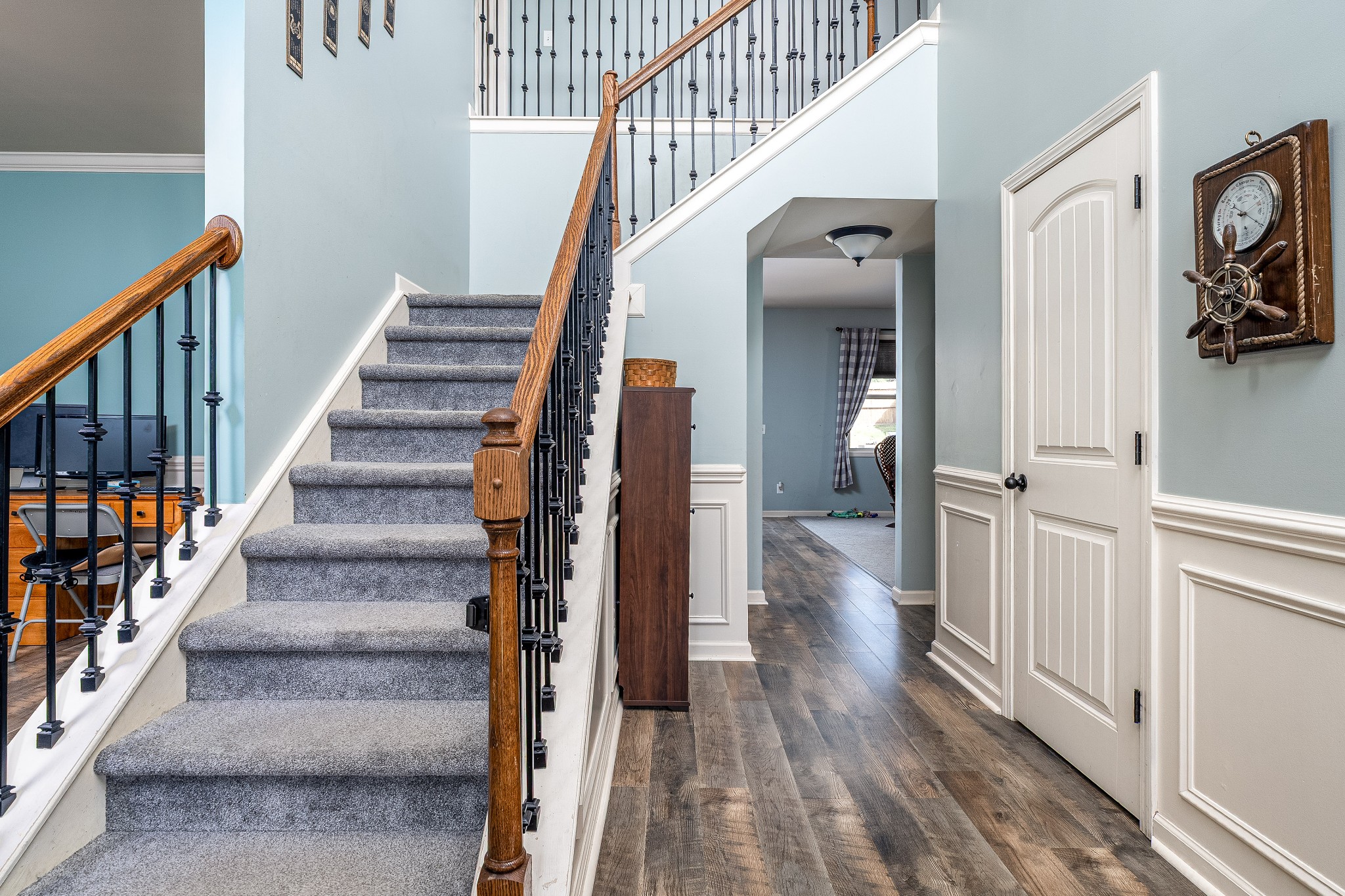 2034 Austin Drive Spring Hill, TN 37174 - Photo 17 of 41 a view of staircase with wooden floor and a chandelier