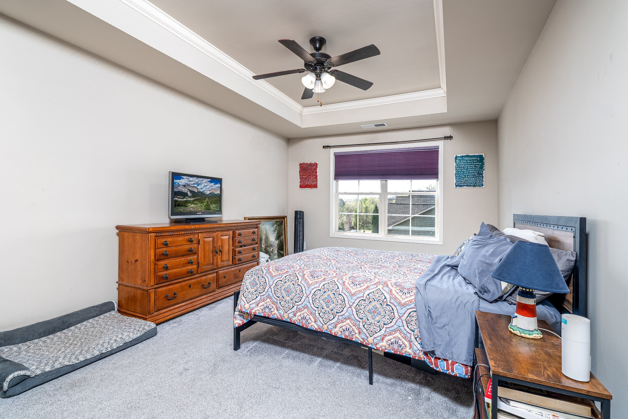 2034 Austin Drive Spring Hill, TN 37174 - Photo 19 of 41 a bedroom with a bed and a chandelier