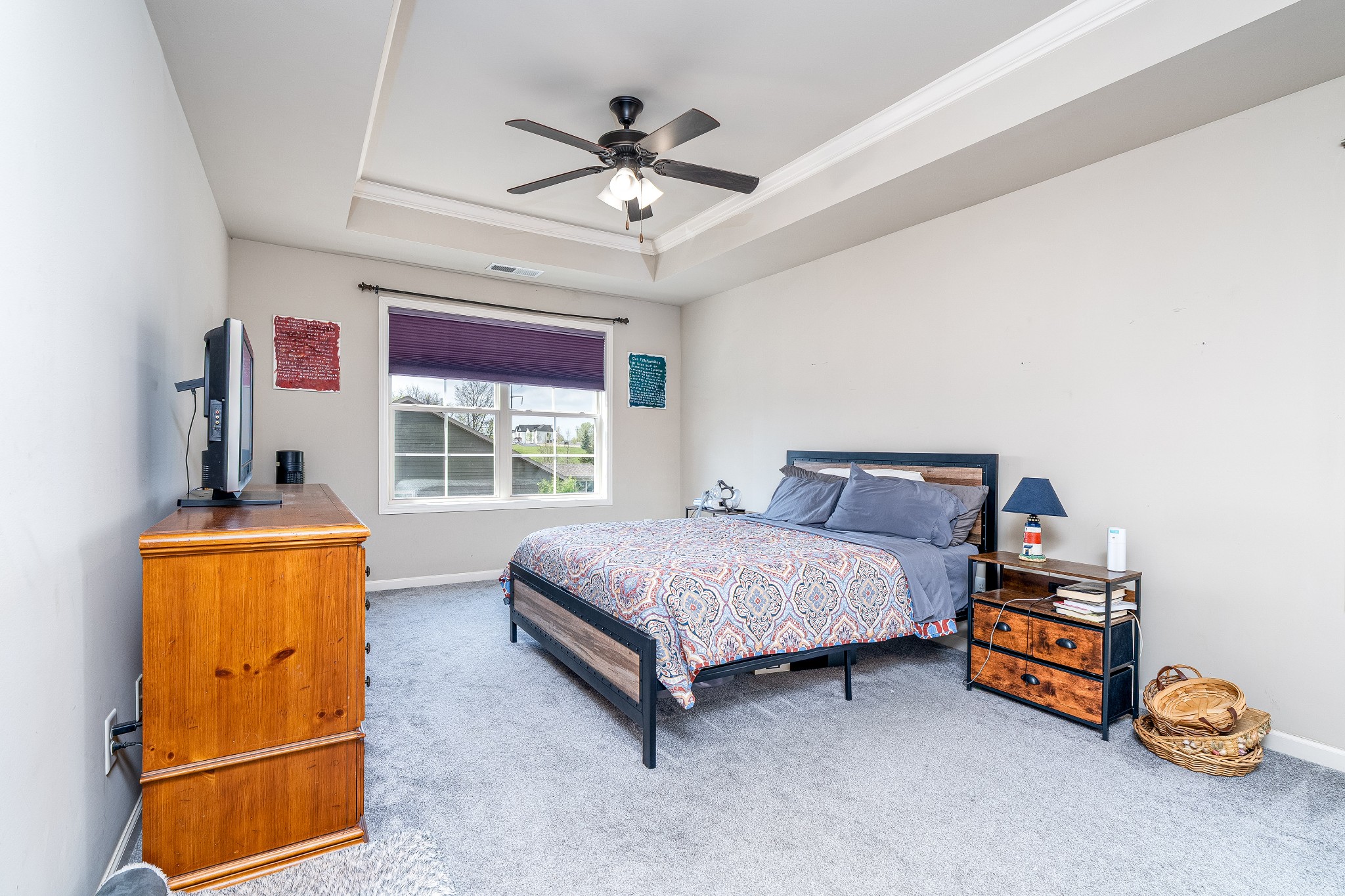 2034 Austin Drive Spring Hill, TN 37174 - Photo 20 of 41 a bedroom with a bed and a chandelier