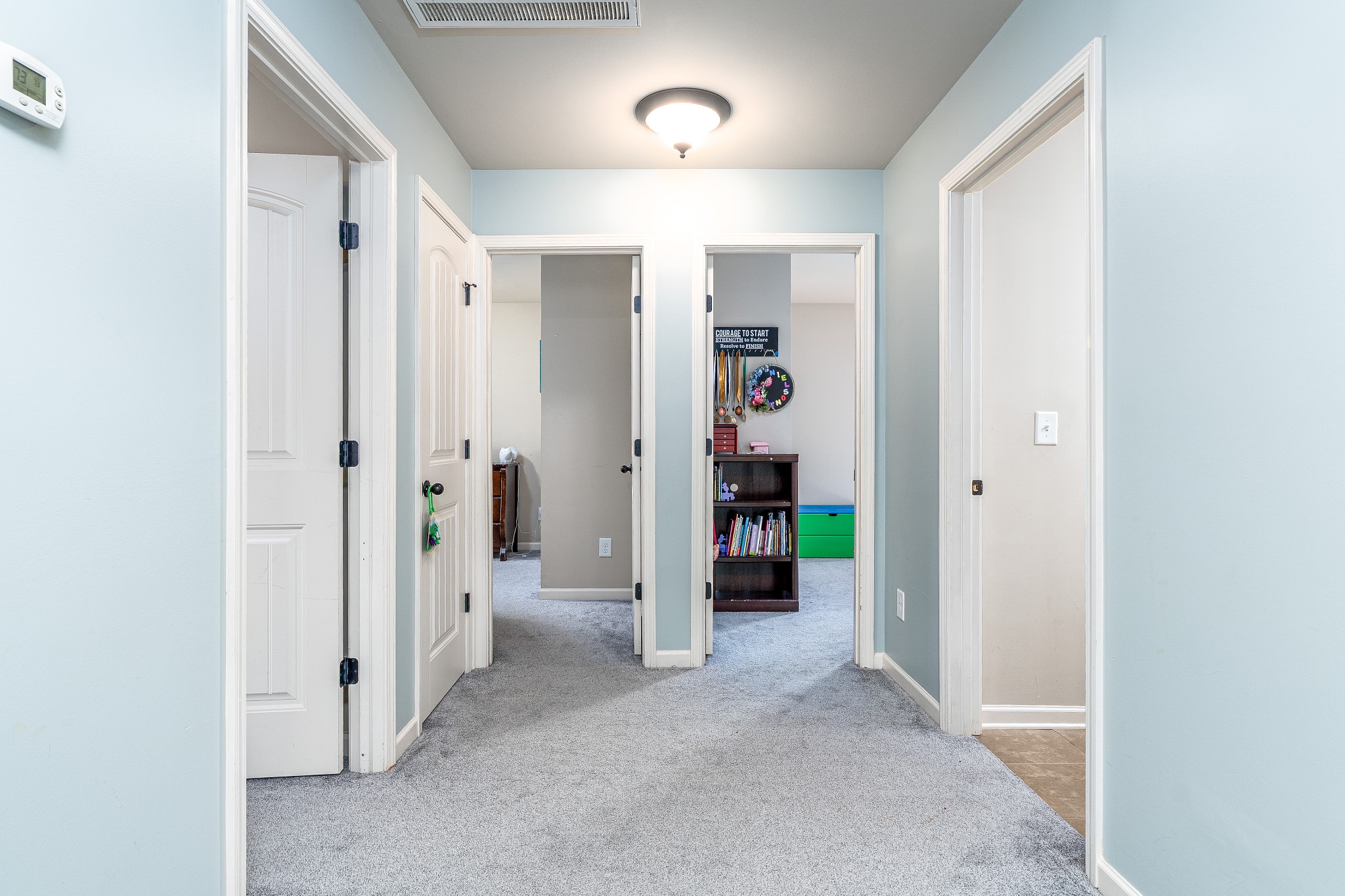 2034 Austin Drive Spring Hill, TN 37174 - Photo 24 of 41 wooden view of a hallway with closet and a bathroom