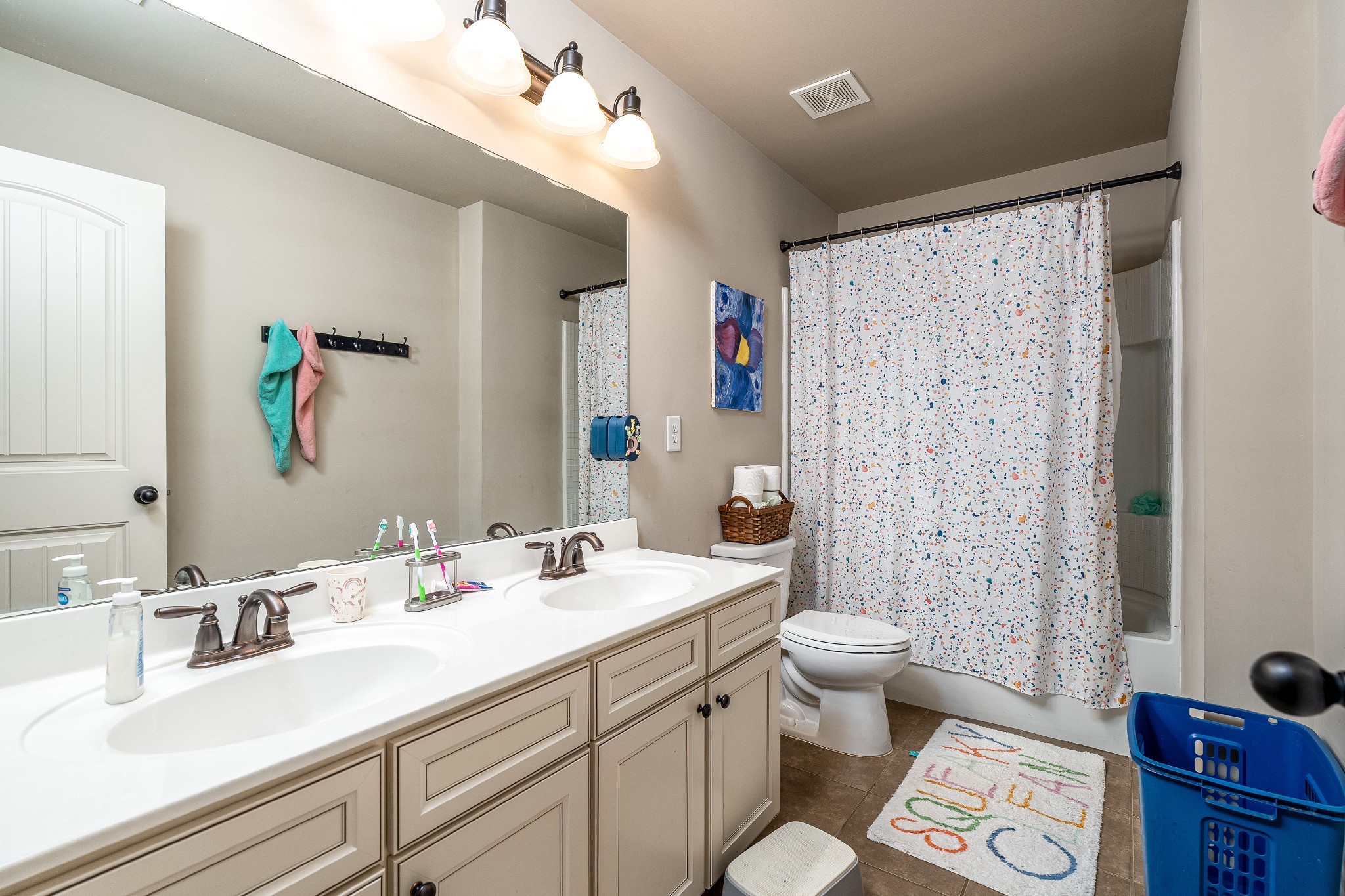 2034 Austin Drive Spring Hill, TN 37174 - Photo 29 of 41 a bathroom with a double vanity sink toilet and shower