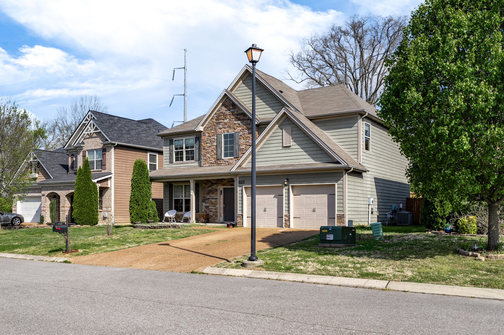 2034 Austin Drive Spring Hill, TN 37174 - Photo 3 of 41 a front view of a house with a yard