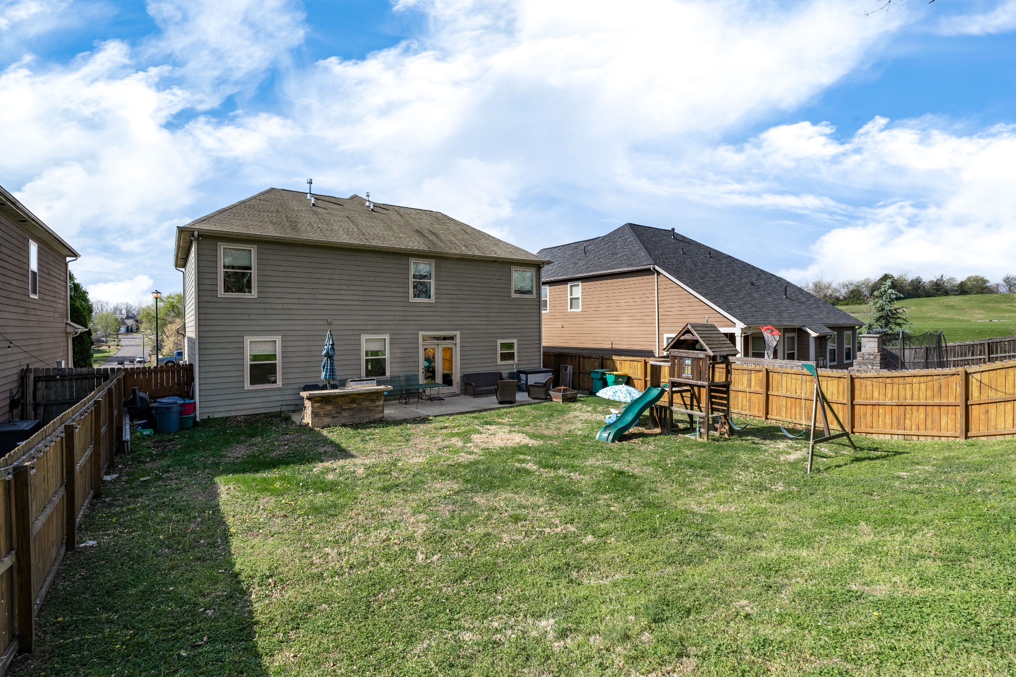 2034 Austin Drive Spring Hill, TN 37174 - Photo 33 of 41 a view of a house with backyard porch and sitting area