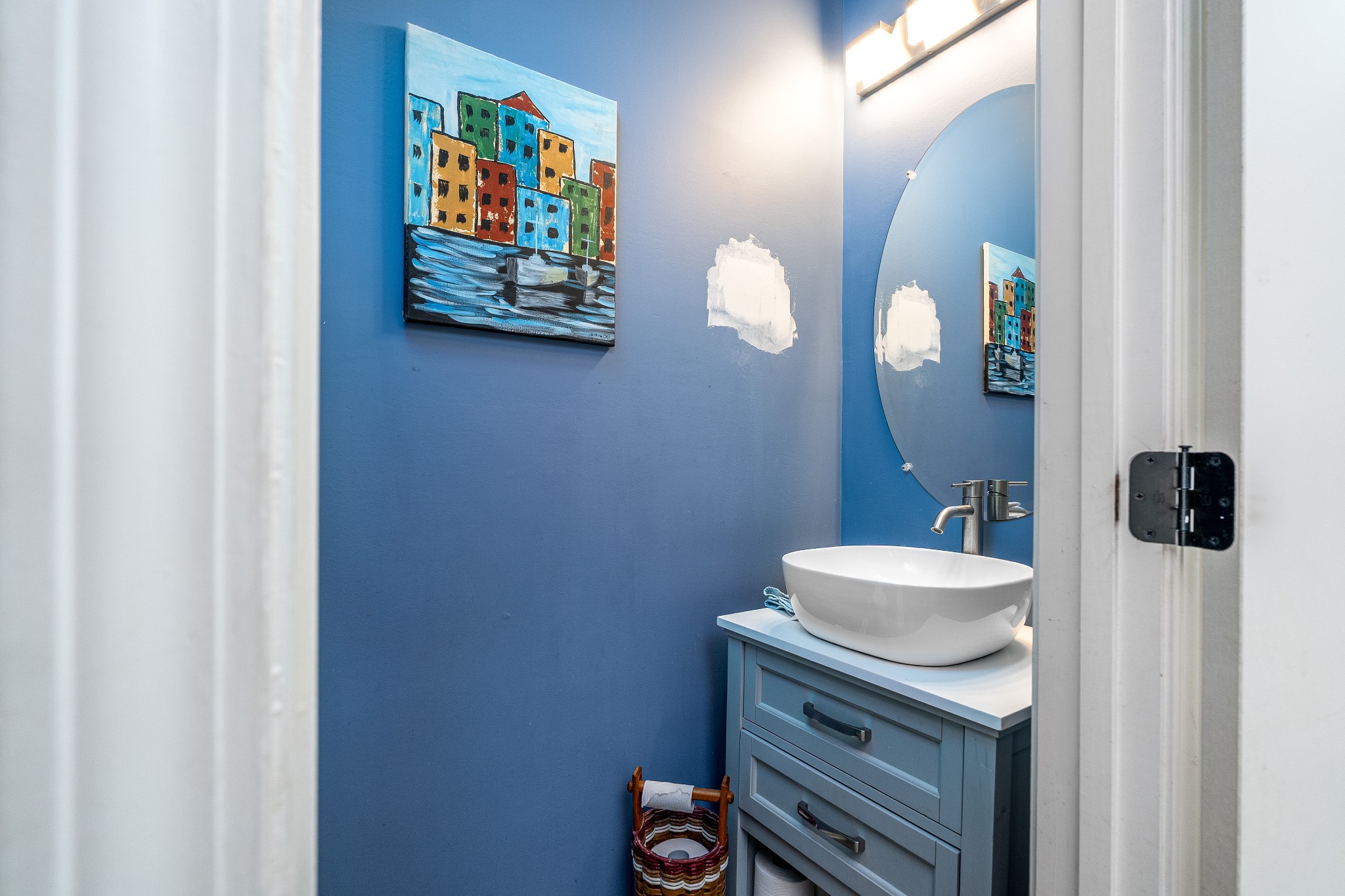 2034 Austin Drive Spring Hill, TN 37174 - Photo 7 of 41 a bathroom with a sink a mirror and painting on the wall