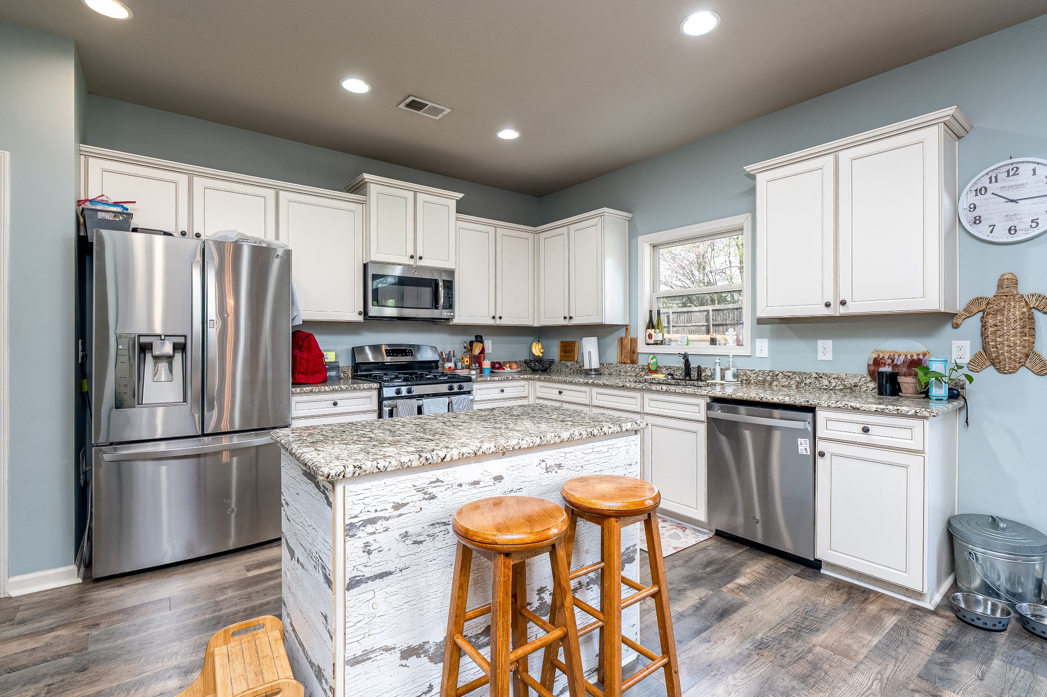 2034 Austin Drive Spring Hill, TN 37174 - Photo 9 of 41 a kitchen with stainless steel appliances granite countertop a refrigerator stove microwave and sink