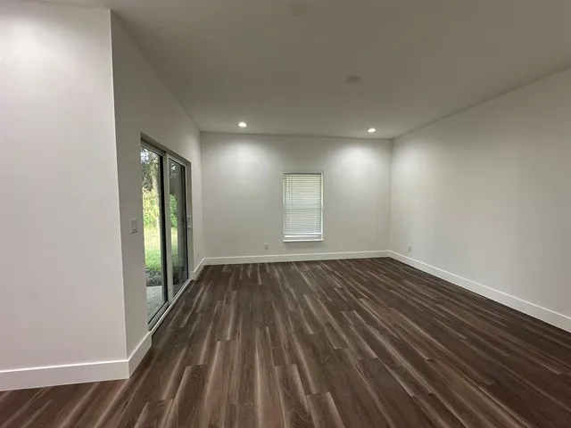 a bathroom with a shower and a sink