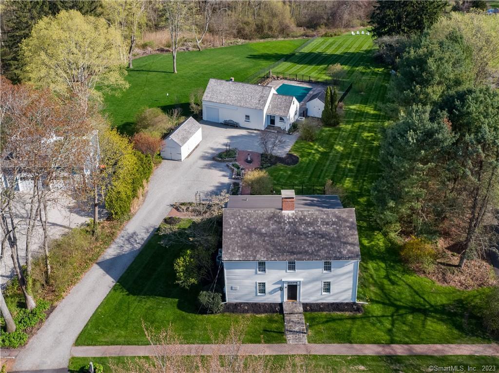 548 Boston Post Road Madison, CT 06443 - Photo 1 of 1 an aerial view of a house with a garden