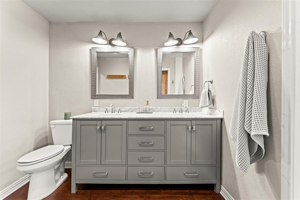 3116 Alexander Avenue Waco, TX 76708 - Photo 22 of 40 a bathroom with a double vanity sink mirror and toilet