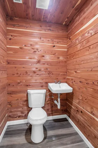 a bathroom with a toilet and a sink