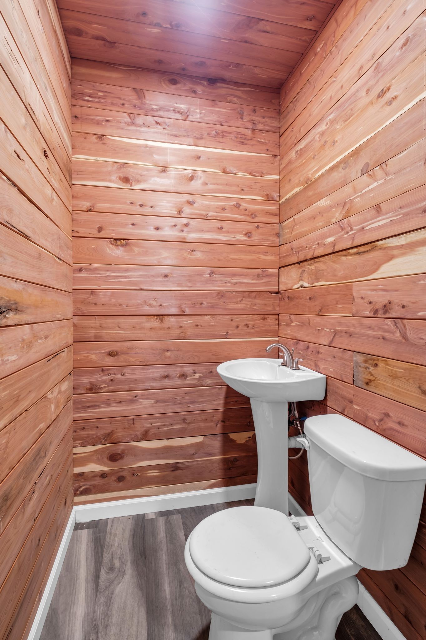 1409 Buffalo Road Lawrenceburg, TN 38464 - Photo 13 of 37 a bathroom with a toilet a sink and mirror