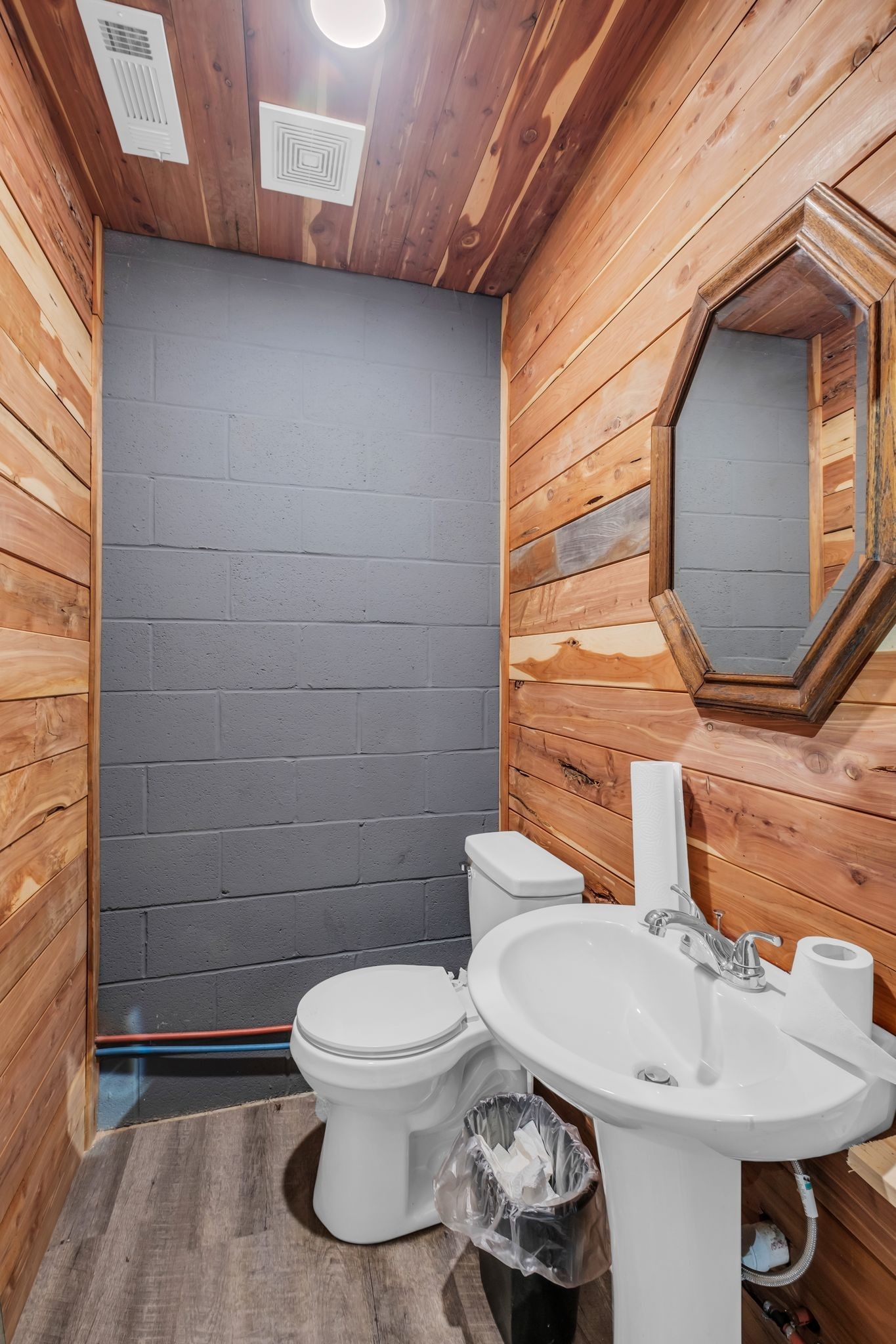 1409 Buffalo Road Lawrenceburg, TN 38464 - Photo 36 of 37 a bathroom with a toilet sink and mirror