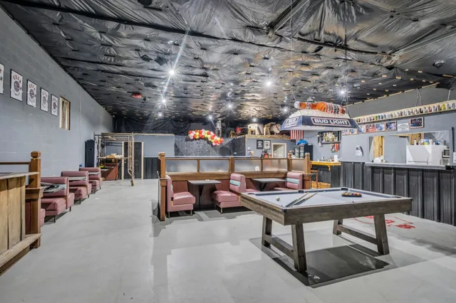 a outdoor space with lots of furniture and clutter