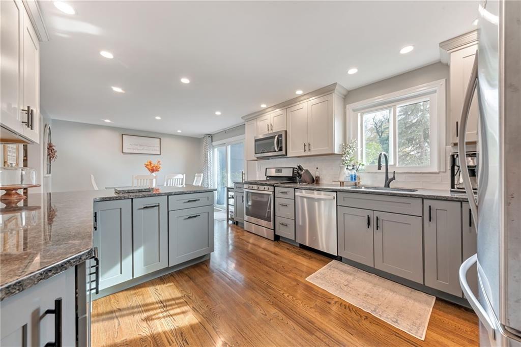 3941 Drexel Road Pittsburgh, PA 15212 - Photo 11 of 25 a kitchen with sink a microwave and cabinets