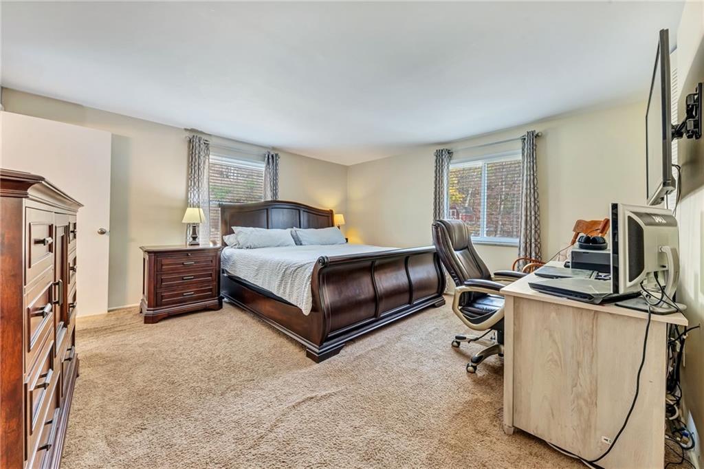 3941 Drexel Road Pittsburgh, PA 15212 - Photo 13 of 25 a bedroom with a bed a computer on desk and a dresser next to a window