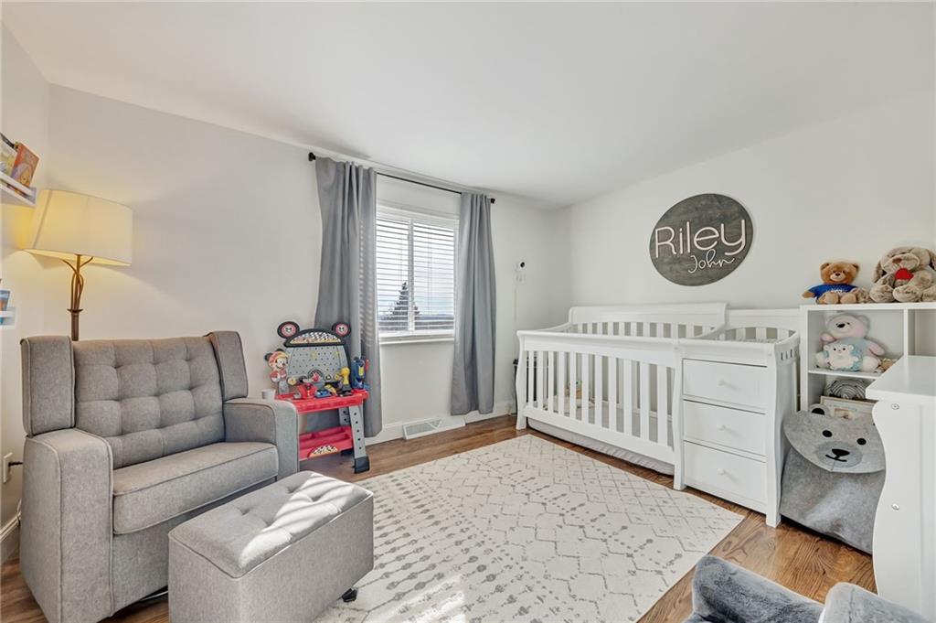 3941 Drexel Road Pittsburgh, PA 15212 - Photo 19 of 25 a living room with furniture and a baby crib