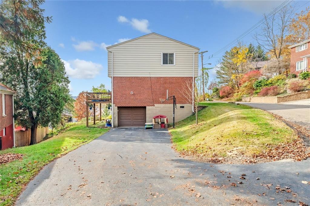 3941 Drexel Road Pittsburgh, PA 15212 - Photo 25 of 25 a front view of a house with a yard and garage