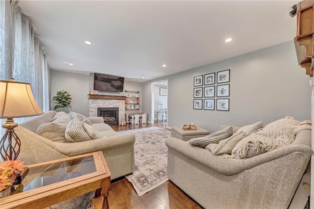 3941 Drexel Road Pittsburgh, PA 15212 - Photo 4 of 25 a living room with furniture and a fireplace