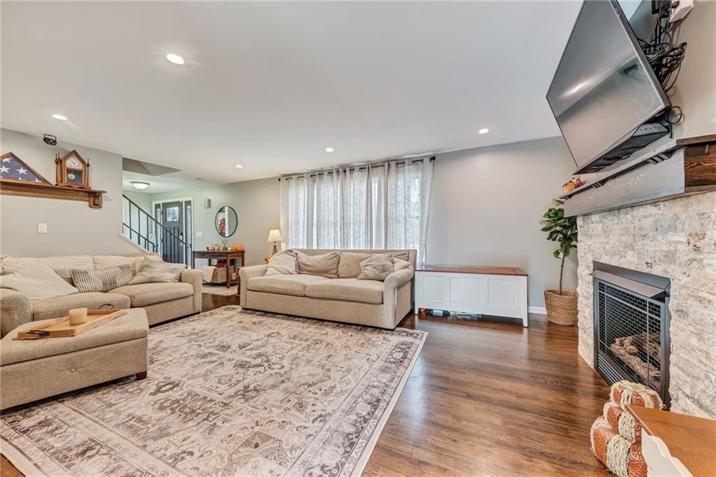 3941 Drexel Road Pittsburgh, PA 15212 - Photo 5 of 25 a living room with furniture and a fireplace