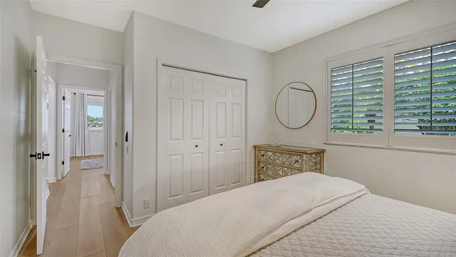 a view of a swimming pool with a patio and a yard